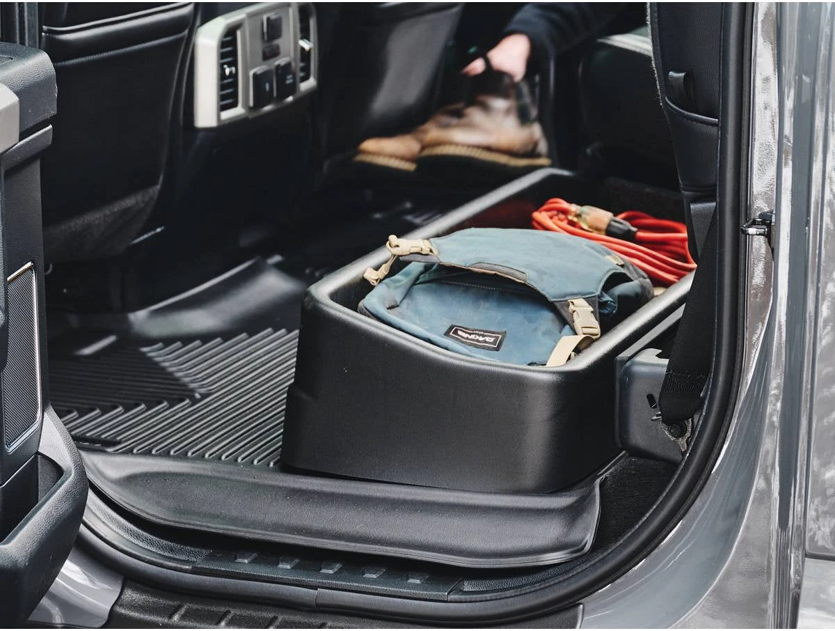 Husky Liners under-seat organizer fitted below a pickup rear bench