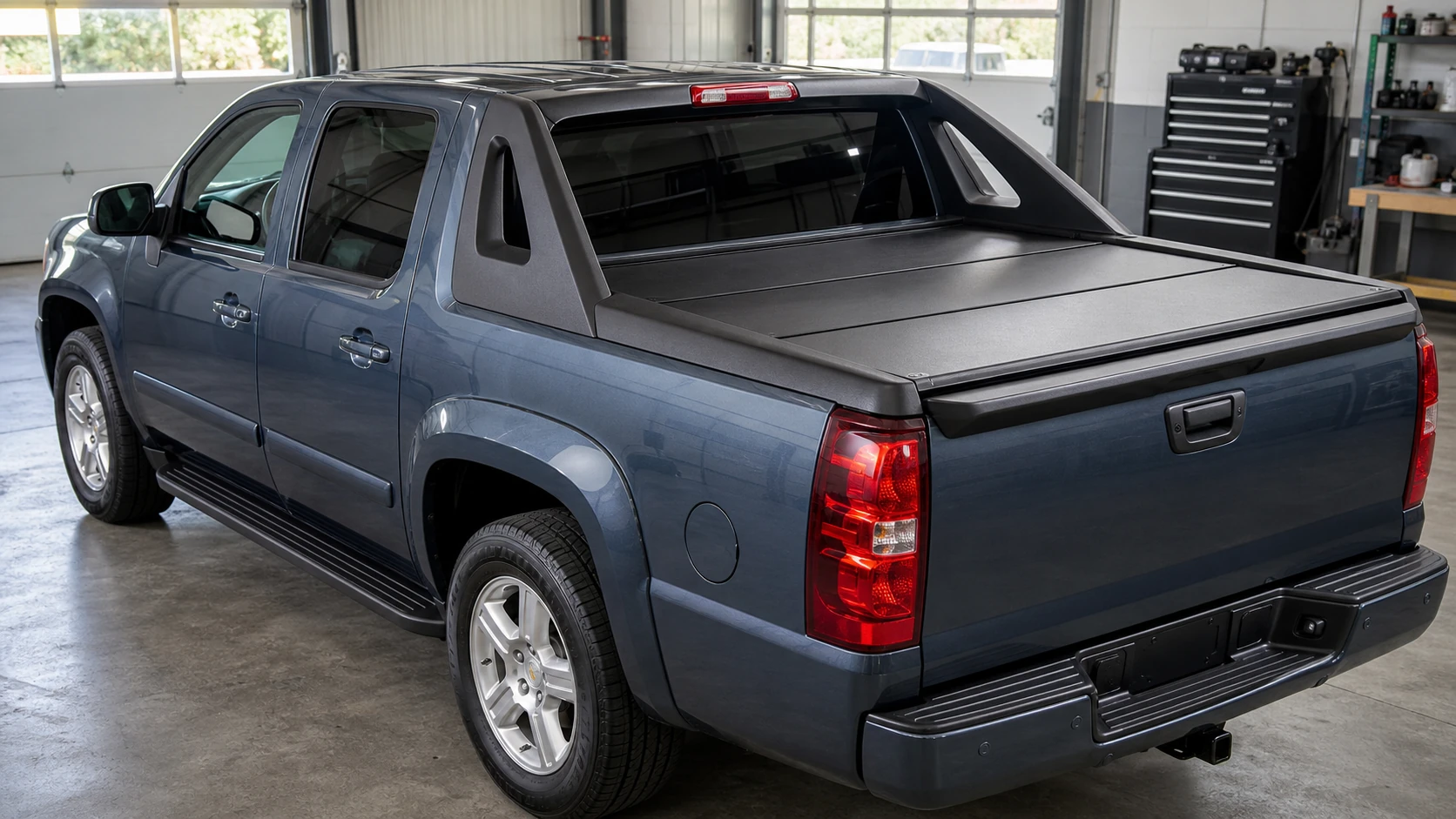 Avalanche-style truck with a closed hard-folding tonneau cover
