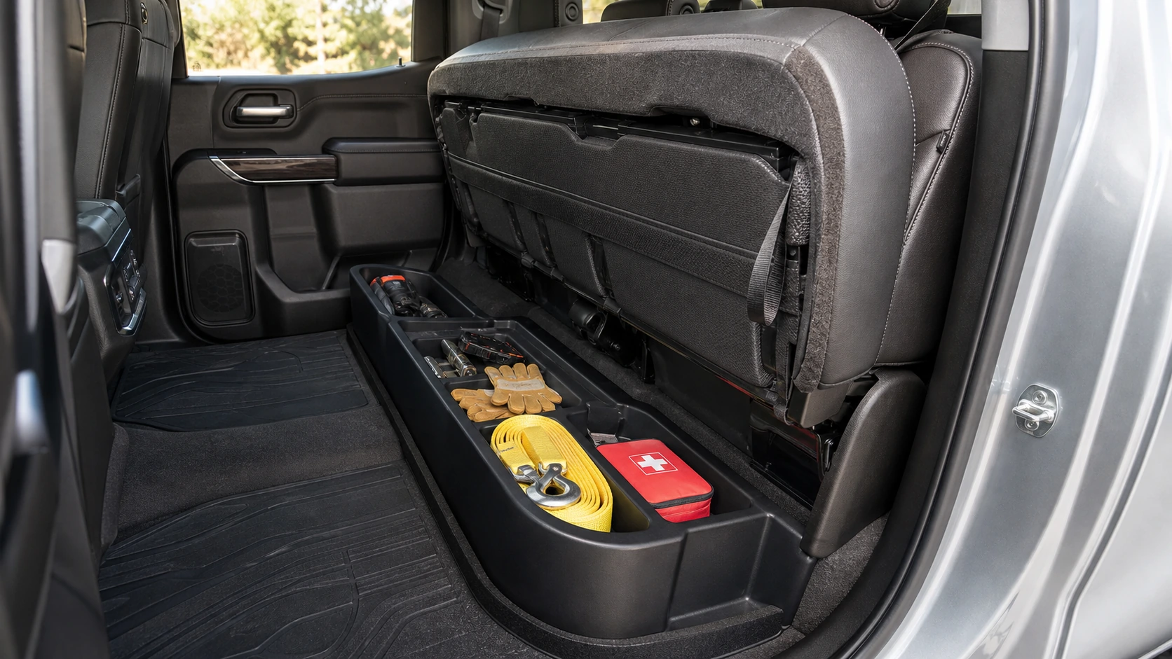 Pickup rear seat raised above an organized under-seat storage bin
